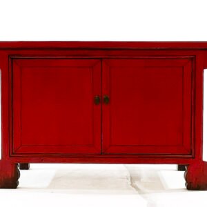 Mueble auxiliar rojo con tablero volado.